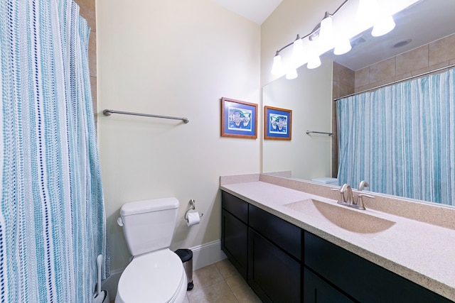 bathroom with tile patterned floors, vanity, toilet, and walk in shower