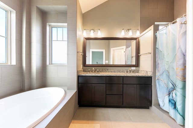 bathroom with tile patterned floors, vanity, lofted ceiling, and shower with separate bathtub