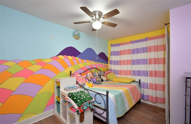 bedroom featuring ceiling fan and dark wood-type flooring