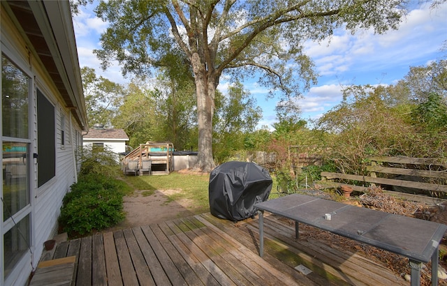 deck featuring a grill