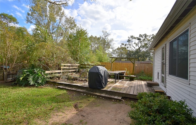 wooden deck featuring grilling area