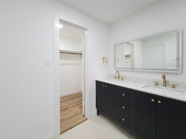 bathroom featuring vanity and hardwood / wood-style flooring