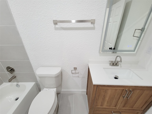 full bathroom featuring tile patterned floors, vanity, toilet, and washtub / shower combination