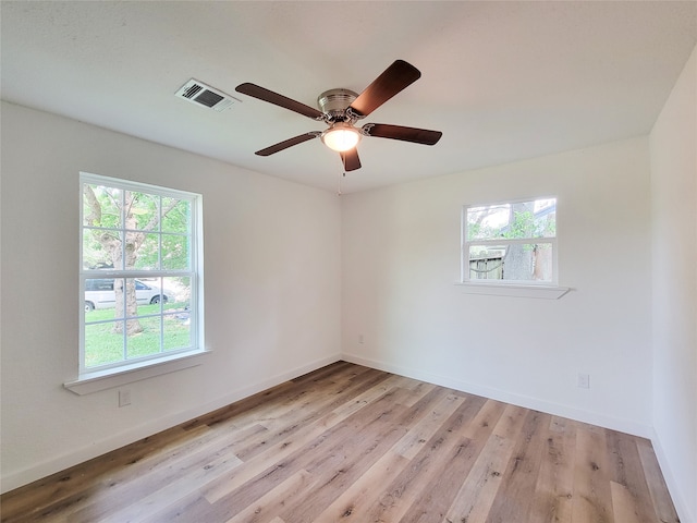 empty room featuring ceiling fan and light hardwood / wood-style flooring