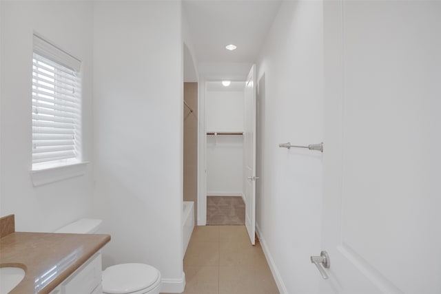 bathroom with tile patterned floors, vanity, and toilet