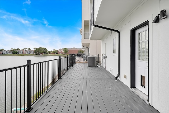 deck featuring central AC and a water view