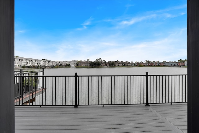 wooden deck with a water view