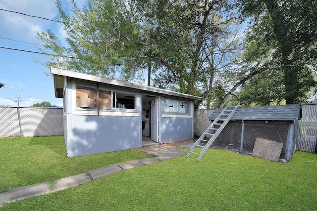 view of outdoor structure featuring fence