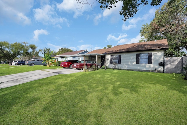 single story home with concrete driveway and a front lawn