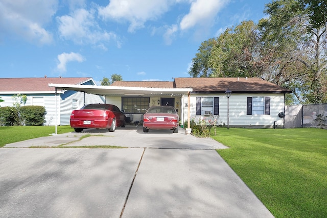 ranch-style home featuring a front lawn and a carport