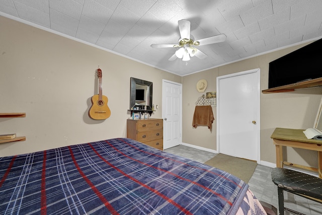 bedroom featuring ceiling fan and ornamental molding