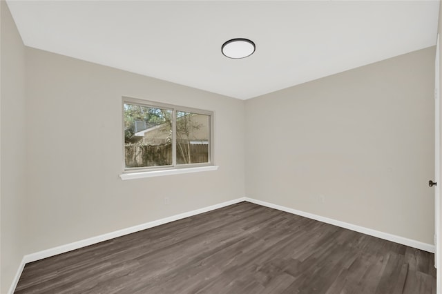 empty room featuring dark wood-type flooring