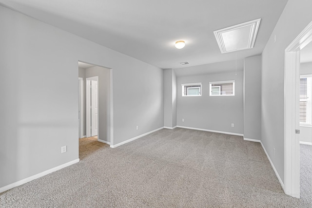 carpeted spare room with plenty of natural light