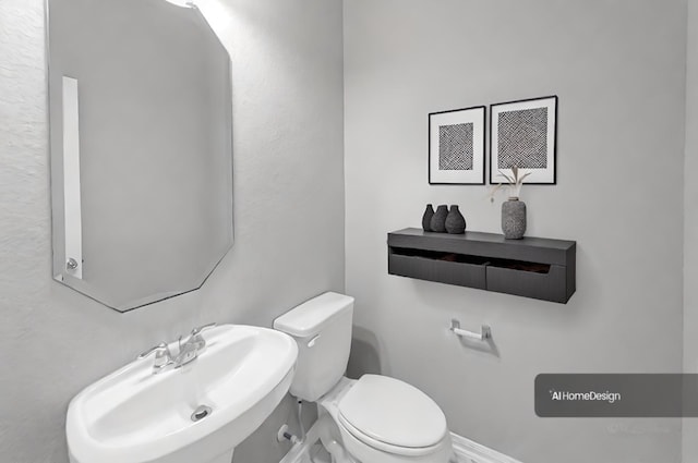 bathroom featuring sink and toilet