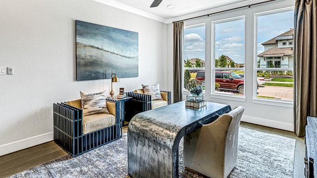 dining space with hardwood / wood-style flooring, ceiling fan, a healthy amount of sunlight, and crown molding