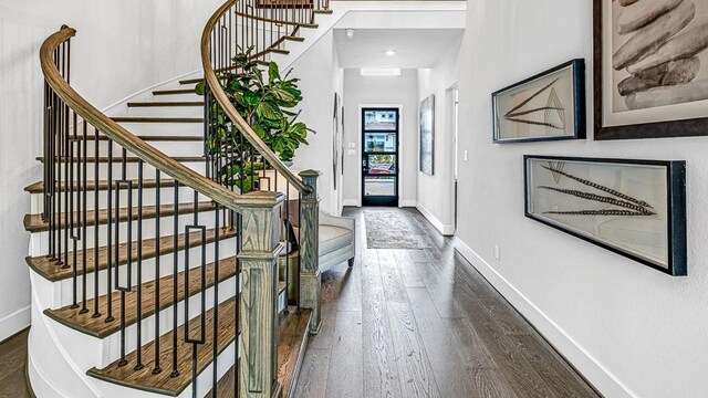 entrance foyer featuring dark hardwood / wood-style floors