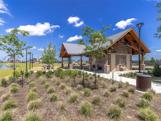 view of community featuring a gazebo and a water view