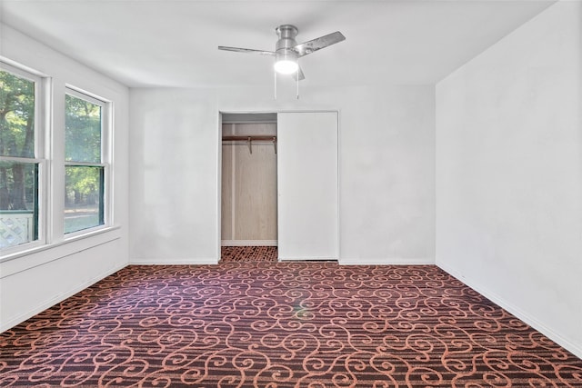 unfurnished bedroom featuring carpet flooring, ceiling fan, and a closet