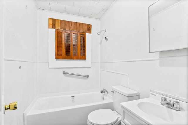 bathroom with a tub to relax in, crown molding, vanity, and toilet