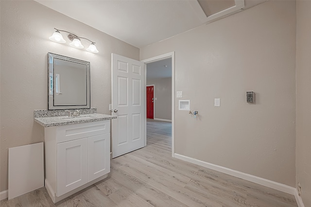 bathroom featuring vanity and wood-type flooring