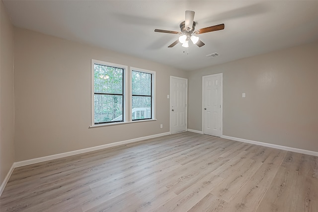 unfurnished room with ceiling fan and light hardwood / wood-style flooring