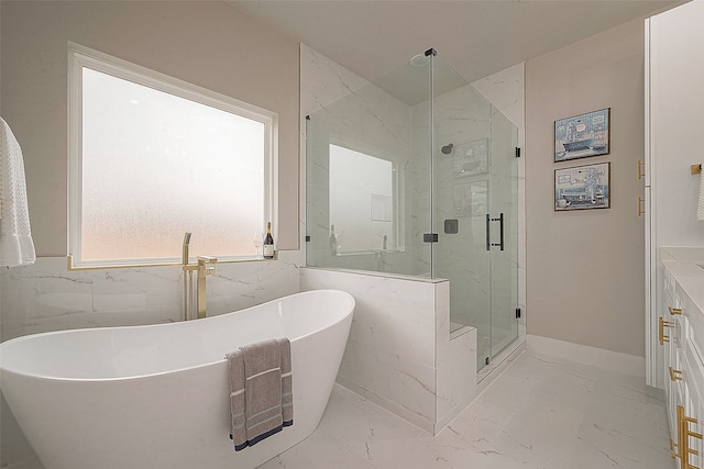 bathroom with tile walls and independent shower and bath