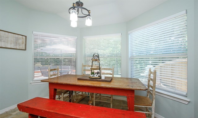 dining space with lofted ceiling and a wealth of natural light