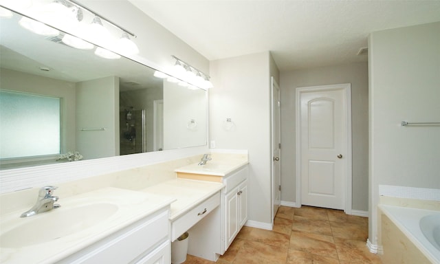 bathroom with vanity and independent shower and bath