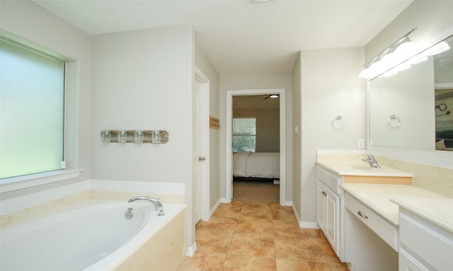 bathroom featuring vanity, a bath, and tile patterned flooring