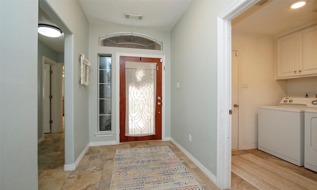 entrance foyer featuring washing machine and clothes dryer