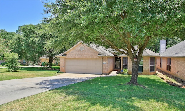 view of front of house featuring a garage and a front yard