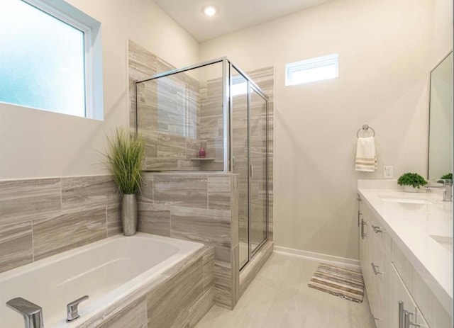 bathroom featuring vanity and plus walk in shower