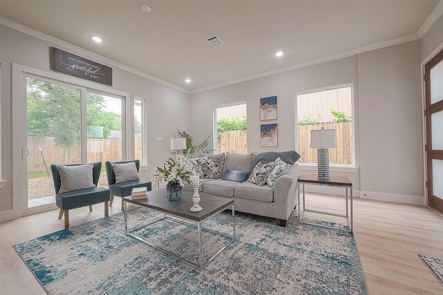 3837 Mainer St, Houston, TX 77021 - living room featuring a wealth of natural light, crown molding, and light wood-type flooring
