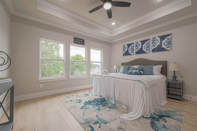 3837 Mainer St, Houston, TX 77021 - bedroom with light wood-type flooring, a raised ceiling, ceiling fan, and ornamental molding