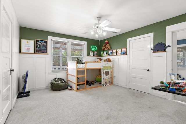 carpeted bedroom featuring ceiling fan