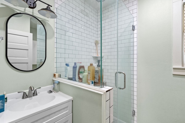 bathroom with vanity and walk in shower