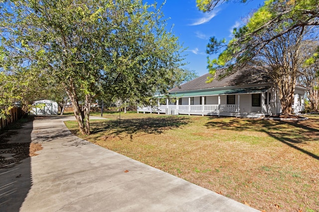 view of yard featuring covered porch