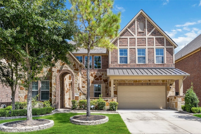 tudor house featuring a garage