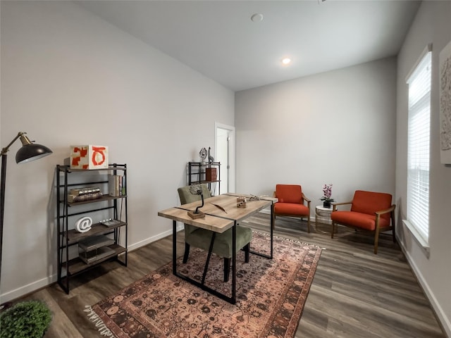 office space with dark wood-type flooring