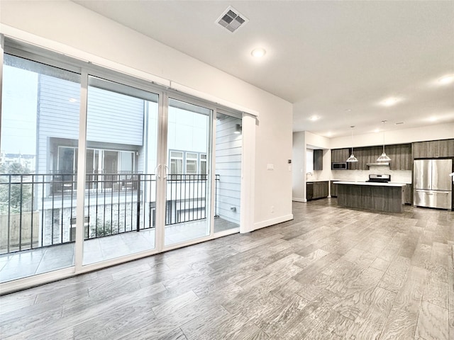 unfurnished living room featuring hardwood / wood-style floors