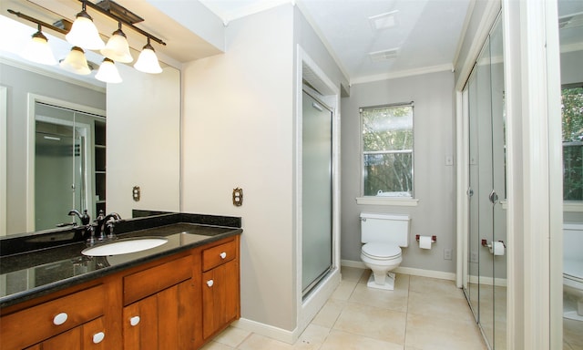 bathroom featuring tile patterned floors, vanity, toilet, and crown molding