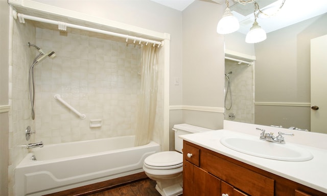 full bathroom featuring shower / bath combination with curtain, vanity, hardwood / wood-style flooring, and toilet