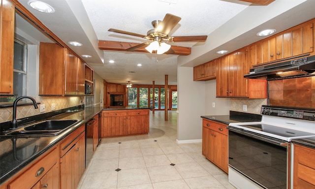 kitchen featuring a textured ceiling, electric range, tasteful backsplash, and sink