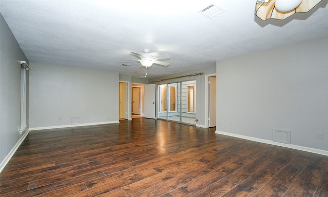 unfurnished room with a textured ceiling, dark hardwood / wood-style floors, and ceiling fan