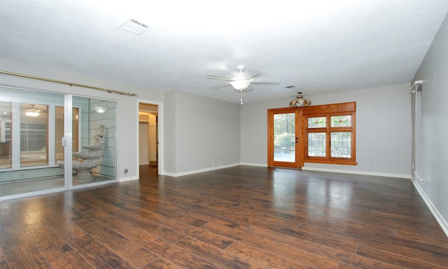 unfurnished room with ceiling fan, dark hardwood / wood-style flooring, and a textured ceiling