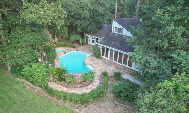 view of pool featuring a sunroom