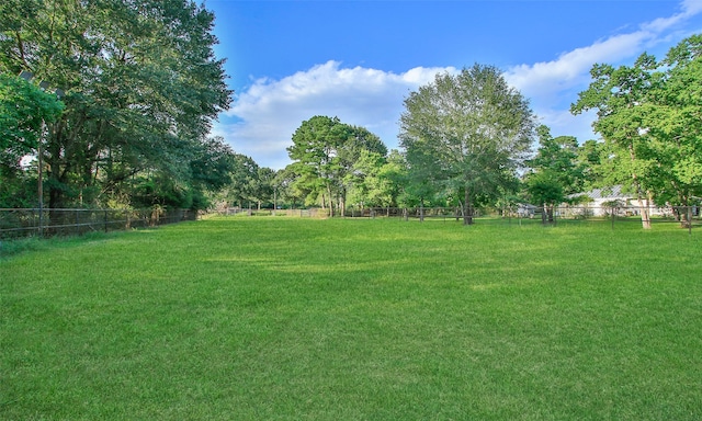 view of yard with a rural view