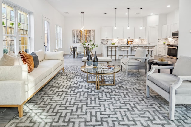 living room with a high ceiling and sink