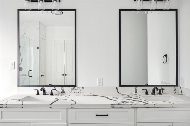 bathroom featuring vanity and an enclosed shower