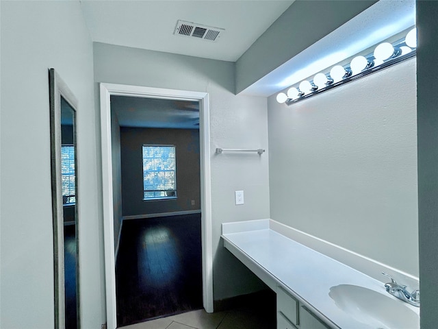 bathroom with hardwood / wood-style flooring and vanity